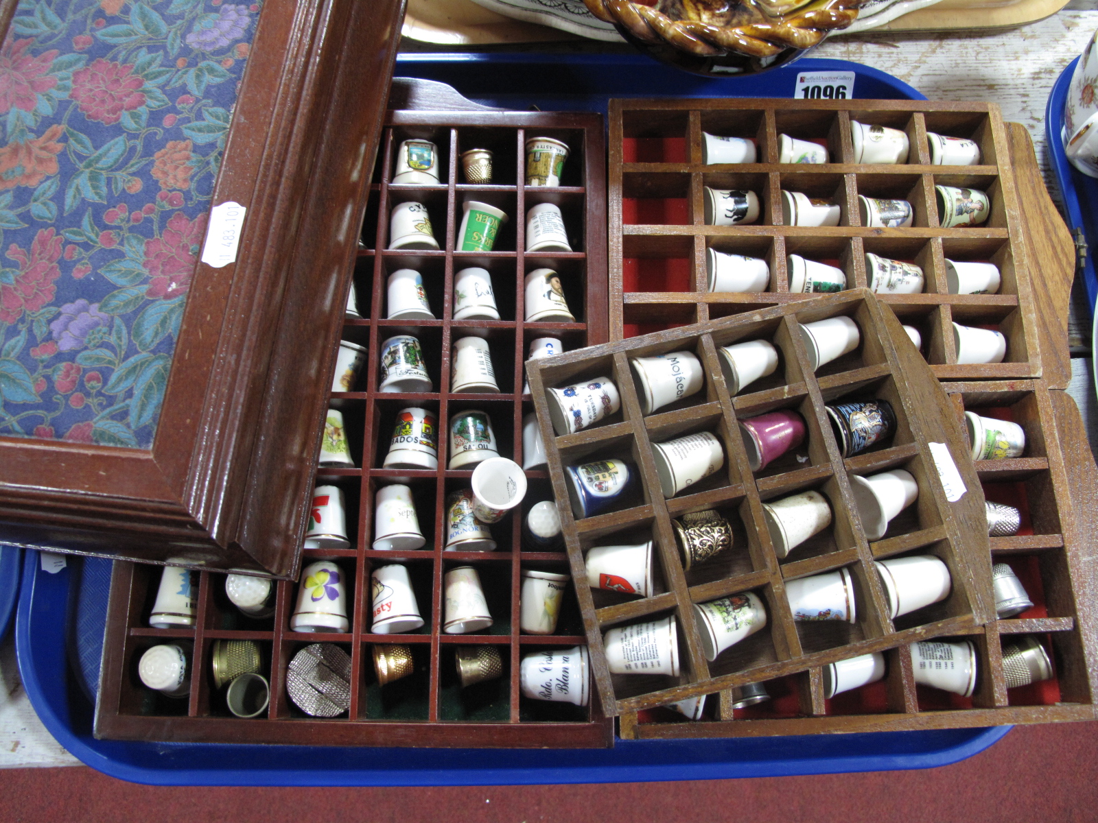 A Collection of Thimbles, three display racks and a wooden jewellery box.