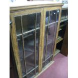 An Early XX Century Oak Bookcase, with glazed doors, internal shelves.