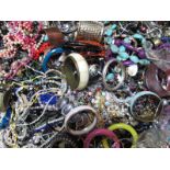 A Large Mixed Lot of Assorted Costume Jewellery, including beads, bangles, etc:- One Box