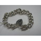 A Solid Curb Link Bracelet, to heart shape padlock style clasp stamped "Silver".