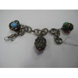 A Fancy Link Bracelet, suspending three larger pendants, each with applied cabochon highlights, to
