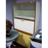 A Mid XX Century White Painted Kitchen Cupboard, with glazed sliding doors, fall front over cupboard