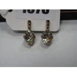 A Pair of Modern 9ct Gold Green Amethyst and Diamond Set Earrings, oval claw set below inset line