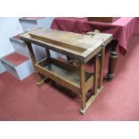 A Hardwood Woodworkers Bench, with vice to end and side, all on a pine base, 66.5cm high.