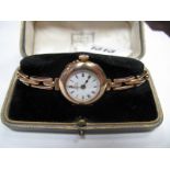 A 9ct Gold Ladies Watch the White Enamel Dial with Black Roman Numerals, retailers name "Jays