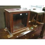 A Mahogany Microscope Case Circa XX Century, with upright sliding glazed door, 48.5cm high x 51cm