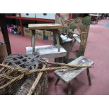 Three Pine Stools, woven cane fishing basket, a pair of carpet beaters, and a wall mirror with