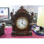 An American Ansonia Clock Company Mahogany Eight Day Mantel Clock, carved foliate arched top with