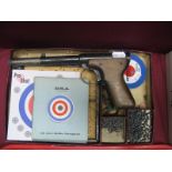 A Mid XX Century .77 Diane Mod 2 Air Pistol, BSA targets, pellets, darts.