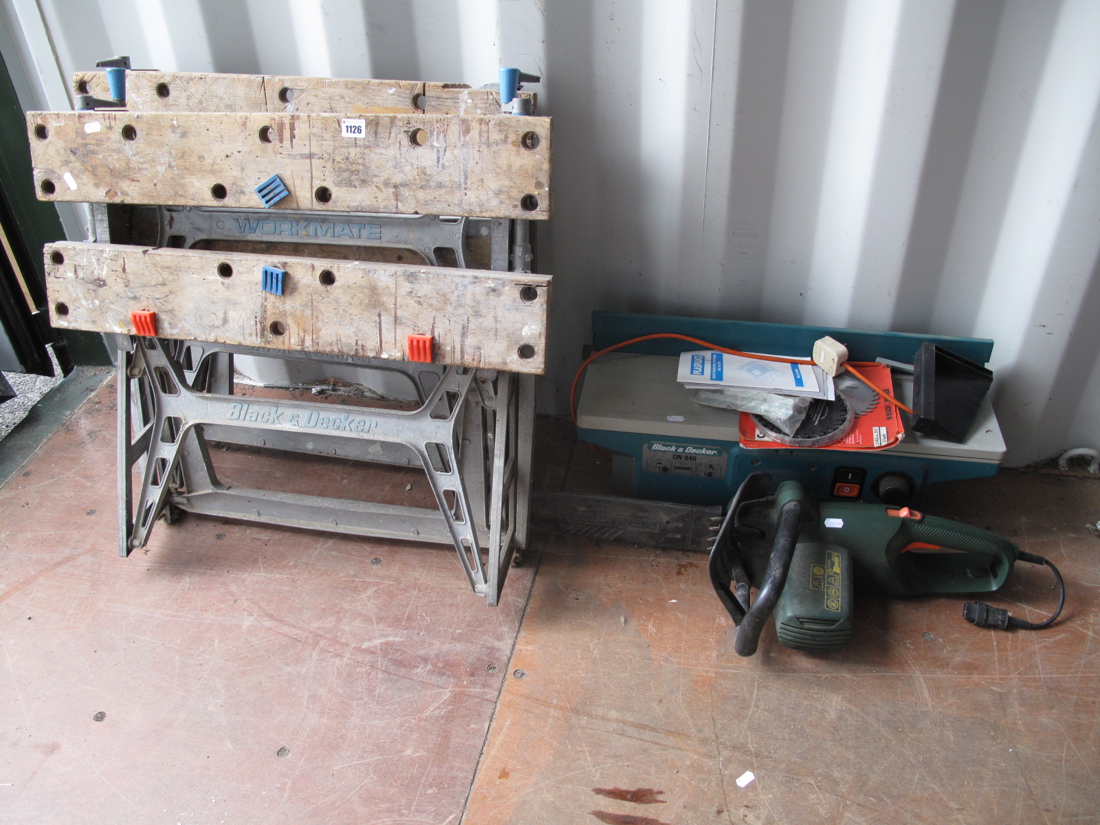 Two Black and Decker Workmate's, and a Black and Decker DN840 bench planer and an electric chainsaw.