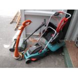 A Bosch Lawn Mower, Black and Decker lawn raker, (both with grass baskets) and a Flymo strimmer. (