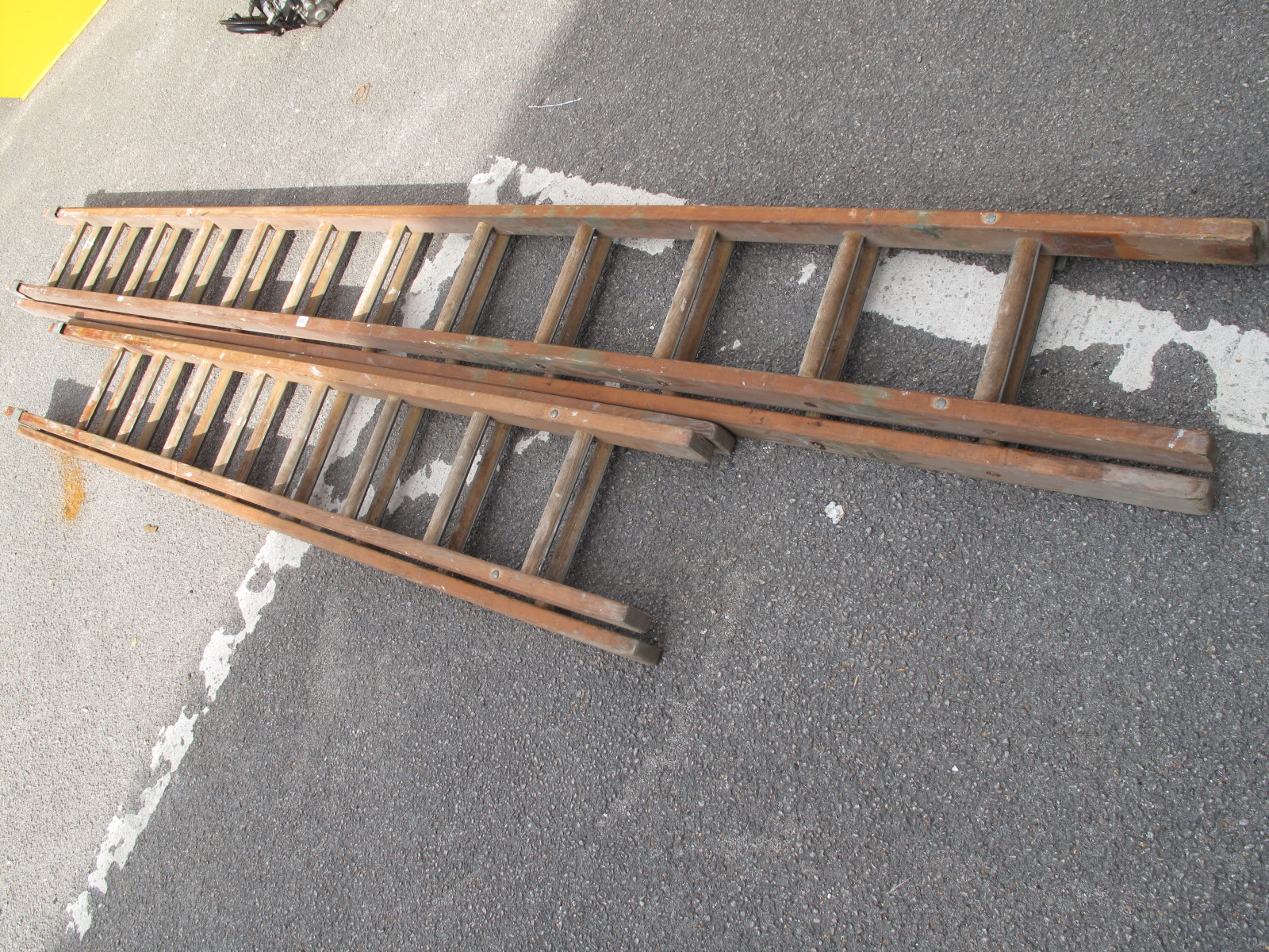 Two Sets of Wooden Extending Ladders. (2)