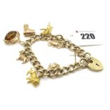 A 9ct Gold Curb Link Charm Bracelet, the plain polished curb links to heart shape padlock style