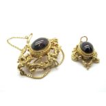 A Victorian Style 9ct Gold Cabochon Garnet Brooch, in Rococo style mount, with detachable pendant