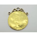 A George III Half Guinea, 1789, applied pendant mount, polished, creases noted.