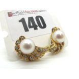 A Pair of 18ct Gold Pearl and Diamond Set Earrings, of fan design, each set to the centre with one