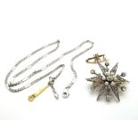 A Victorian Diamond Set Starburst Brooch, set throughout with graduated old cut stones and pearl