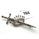 A Victorian Bohemian Garnet Sword Brooch, designed as a sword piercing a coronet, set throughout