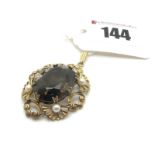 A 9ct Gold Smokey Quartz and Pearl Set Pendant, oval claw set to the centre within openwork border