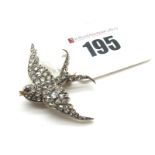 A Diamond Set Swallow Brooch, designed as a swallow in mid flight, set throughout with rose cut