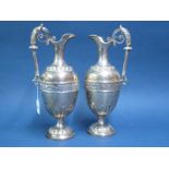 A Pair of Hallmarked Silver Ewers, E&CoLd, Birmingham 1891, each of classical style, with band of