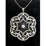 A Large Early XX Century Belle Époque Diamond Set Openwork Pendant/Brooch, of shaped circular