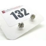 A Pair of 18ct White Gold Single Stone Diamond Earstuds, each brilliant cut stone four claw set.