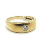 A 9ct Gold Single Stone Diamond Ring, the brilliant cut stone rubover set within plain tapering