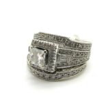 A Modern Neil Lane Princess Cut Diamond Ring, with square border of brilliant cut diamonds,