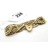 A 9ct Gold Bracelet, to heart shape padlock style clasp.