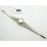 Accurist; A 9ct White Gold Ladies Dress Wristwatch, the signed circular dial with baton markers,