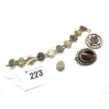 A Lava Cameo Bracelet (damages); together with two Scottish style hardstone brooches.