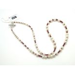 A Modern Single Strand Fresh Water Pearl Bead Necklace, of graduated design, highlighted with