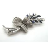 A Stylish Vintage Sapphire and Diamond Set Cocktail Dress Clip, of abstract floral spray design, set