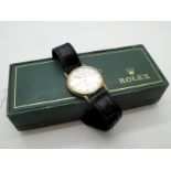 Rolex; A Vintage 9ct Gold Cased Gent's Wristwatch, the signed dial with line markers and centre