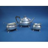 A Hallmarked Silver Three Piece Tea Set, Walker & Hall, Sheffield 1922, each of plain rounded