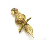 A Vintage Multi Gem Set Cocktail Brooch, as a bird, of two tone textured design, highlighted with