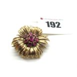 A 9ct Gold Brooch of Modernist Flower Design, with a central claw set cluster of rubies.