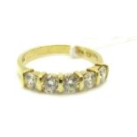 An 18ct Gold Five Stone Diamond Ring, bar set with uniform brilliant cut stones, approximate total