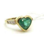 A Heart Shape Emerald Single Stone Dress Ring, collet rubover set to the centre, between diamond set