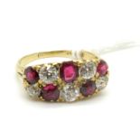 A Ruby and Diamond Ten Stone Ring, alternatively set with old cut diamonds, within scroll carved