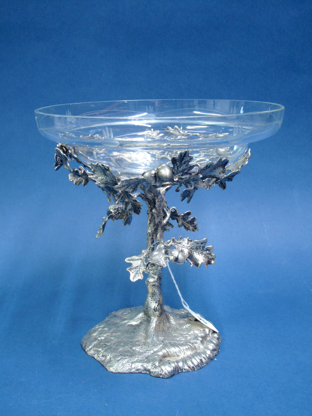 A Decorative Table Centrepiece, the etched glass bowl supported on oak tree style stand and