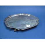 A Hallmarked Silver Salver, GH, Sheffield 1930, of plain shaped square form, raised on four scroll