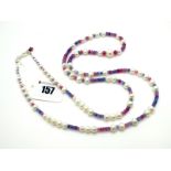 A Modern Long Single Strand Fresh Water Pearl Bead Necklace, of graduated design, highlighted with