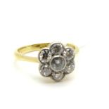 An Edwardian Diamond Flowerhead Cluster Ring, the brilliant cut stones rub over collet set,