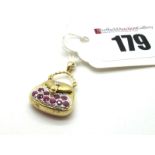 A Modern Novelty Handbag Charm Pendant, articulated, with inset highlights, stamped "14K".