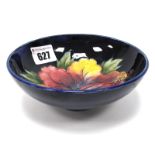 A Moorcroft Pottery Bowl, of footed circular form, painted in the 'Hibiscus' pattern against a