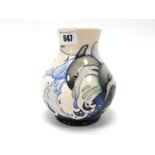 A Moorcroft Pottery Vase, of baluster form, painted in the 'Royal Dolphins' pattern against a