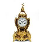 A XIX Century French Red Tortoiseshell Boulle and Gilt Brass Mounted Mantel Clock, by Maple & Co.