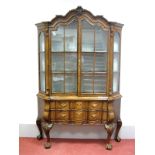 A Dutch XVIII Century Style Walnut Display Cabinet, with shaped and scrolled pediment, twin glazed